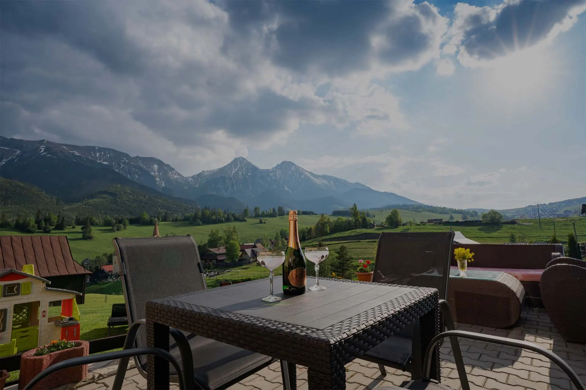 Glasses on the terrace table, with the Belianske Tatras behind